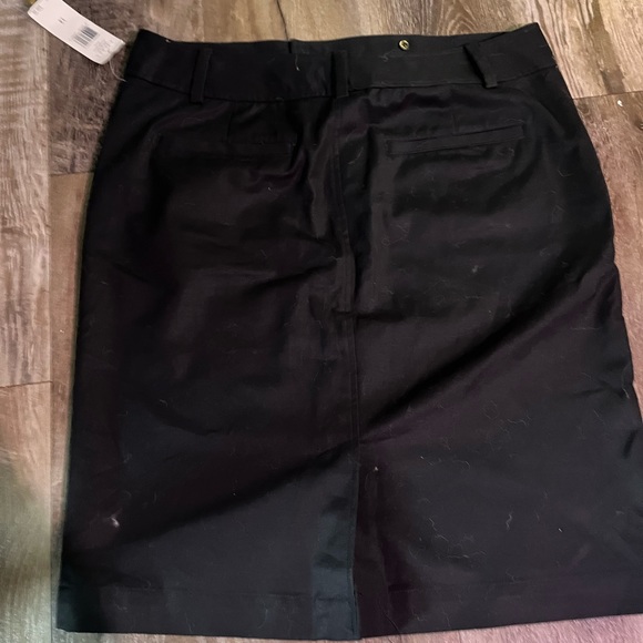 Woman’s mid length black skirt with gold button detail - Picture 2 of 3